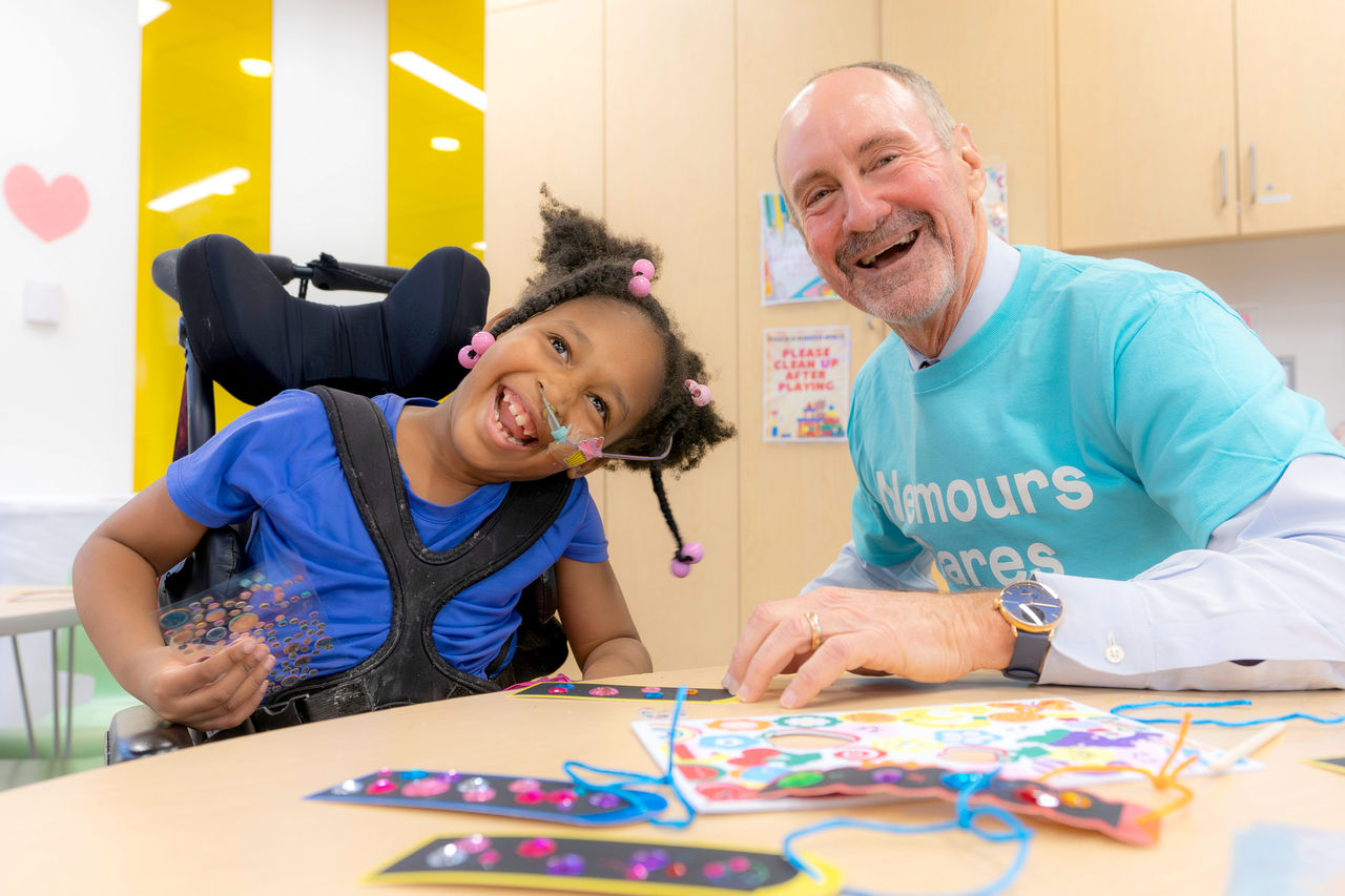 Dr Moss with patient at Nemours Cares event 