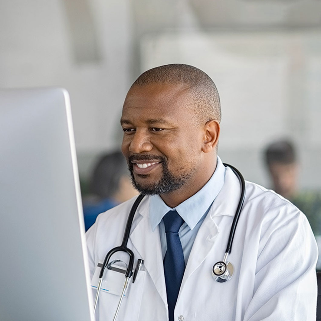 Doctor looking at a computer