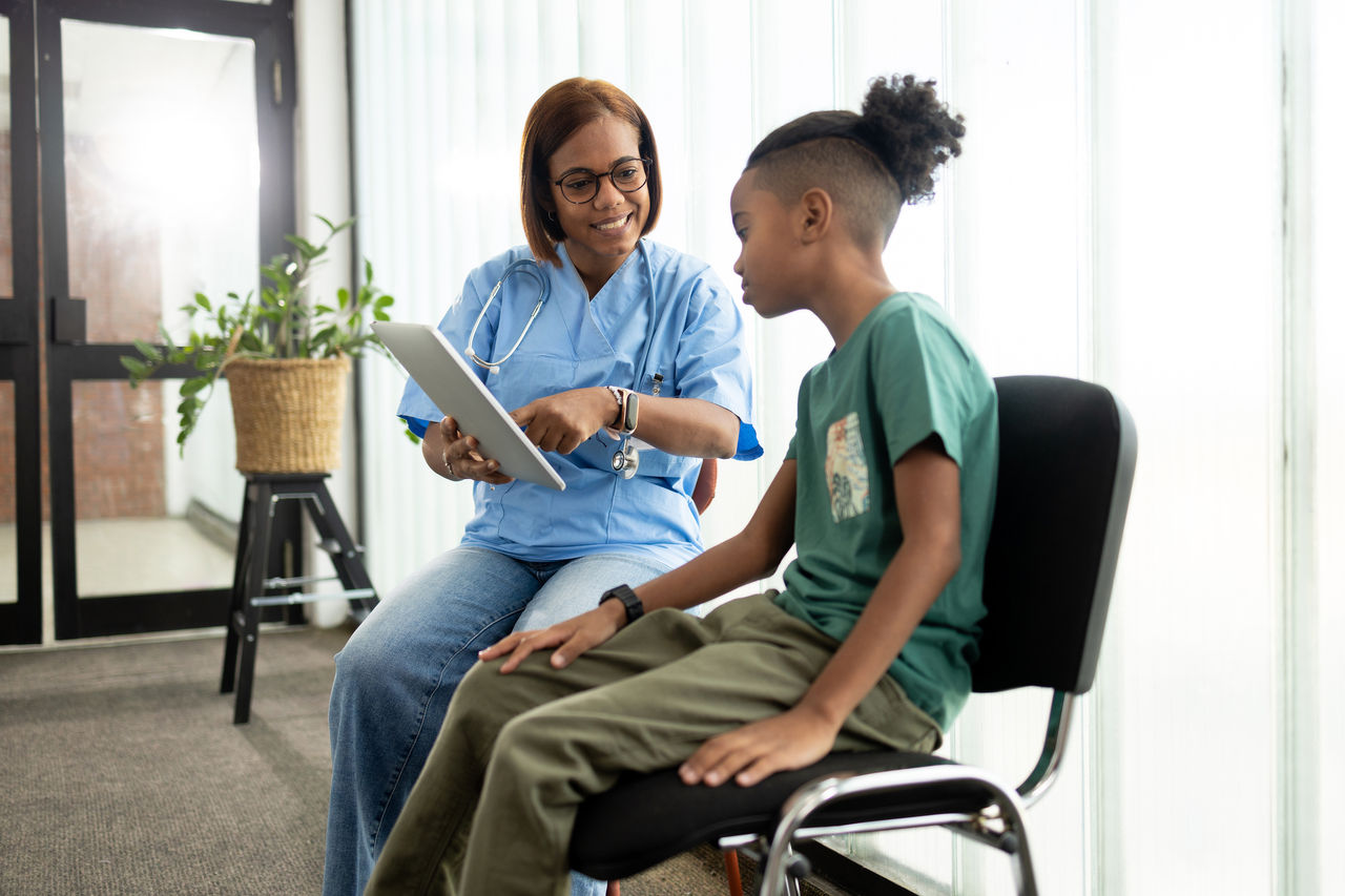 Doctor speaking with child.