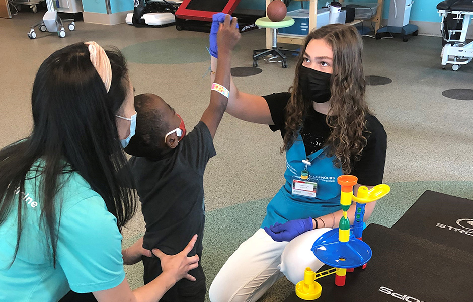 Volunteer working with a kid