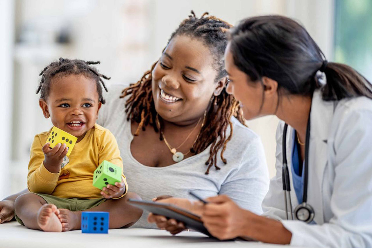 Doctor with mother and child