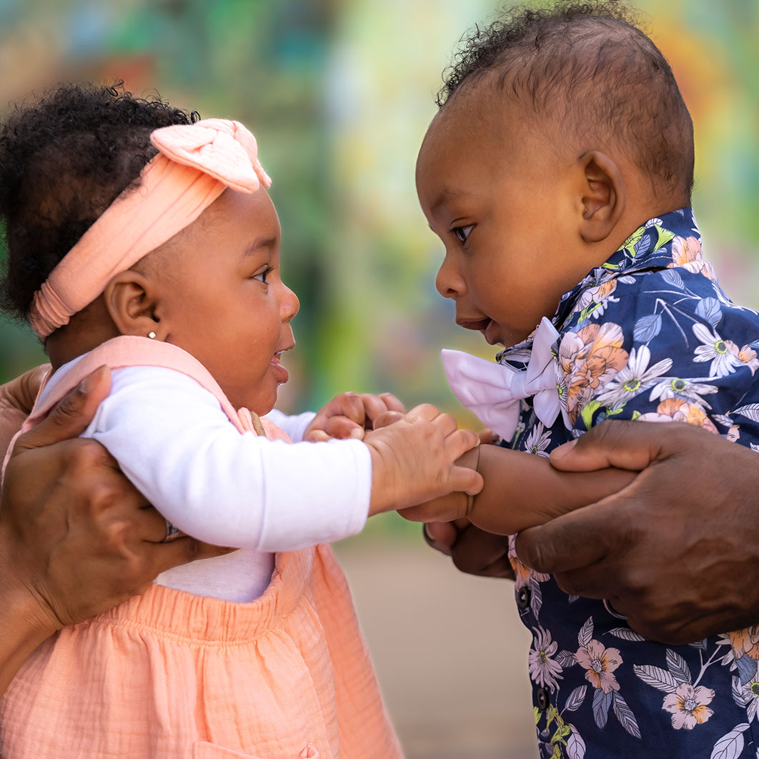 Bailey and Braxton, twins holding hands