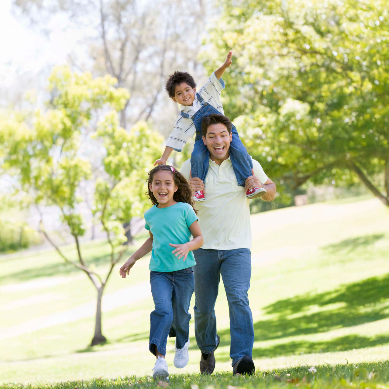 family outside in park family outside in park