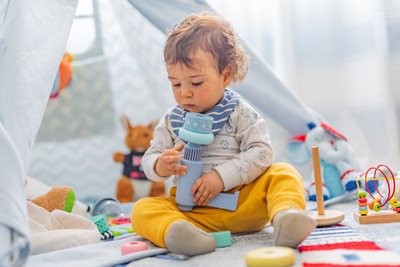 Toddler playing on the ground