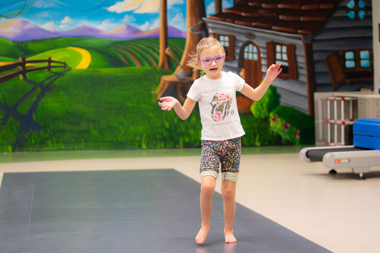 Young female patient walking in the gait lab