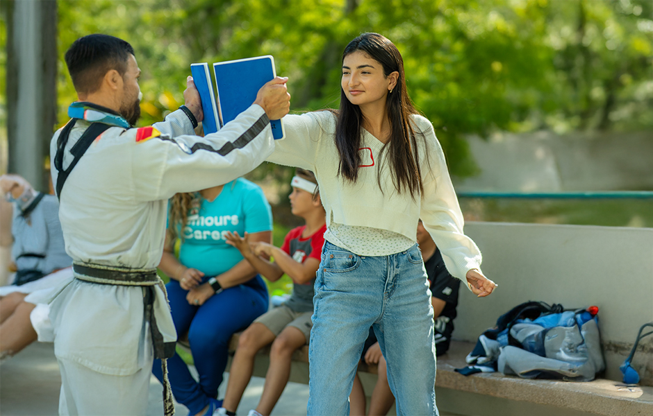 Cochlear implant summer camp child with an instructor
