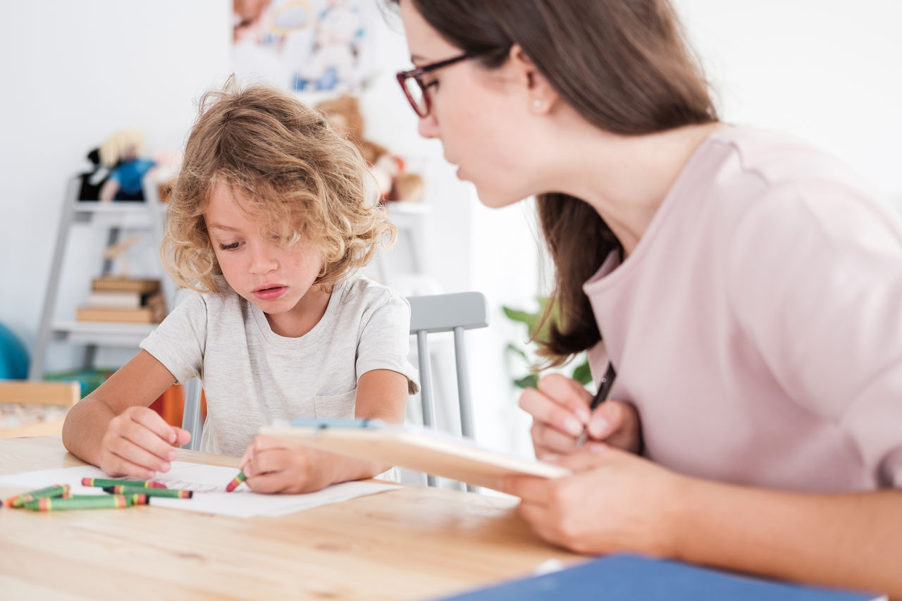 Young learner engaged in drawing activity.