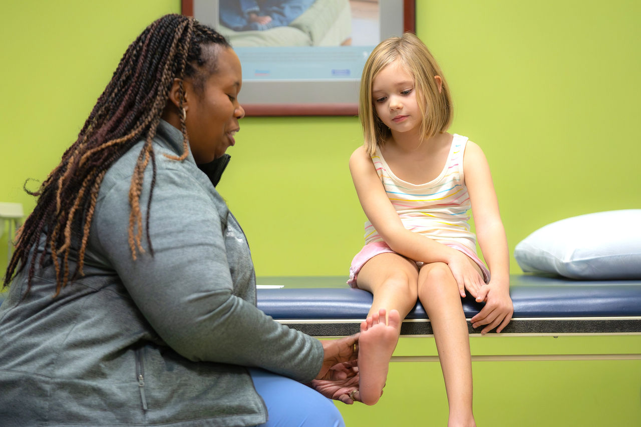 Nurse with patient in gait lab