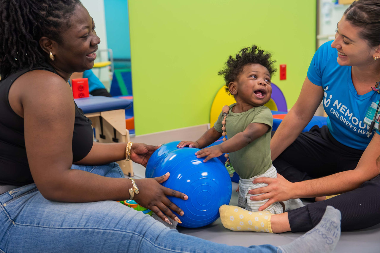 Therapists working with child 