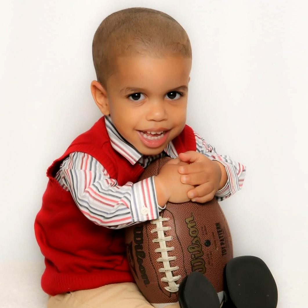 Braulin holding a football