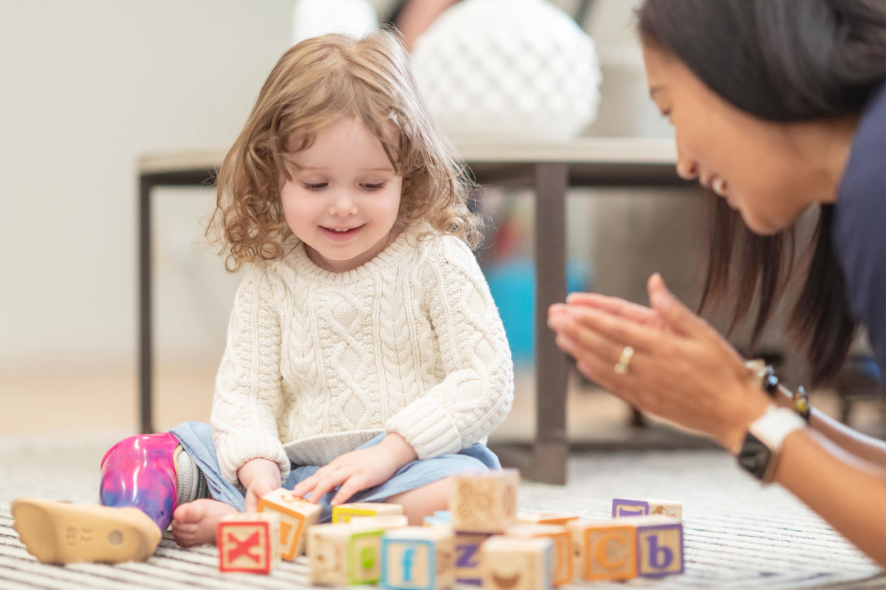 Child playing with wooden blocks