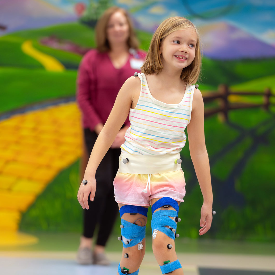 Young female patient walking in Gait Lab