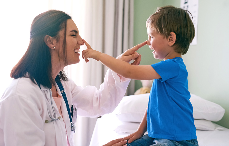 doctor and child with fingers on the tip of the nose