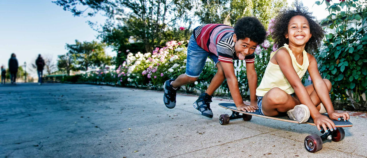 Kids on skateboard laughing