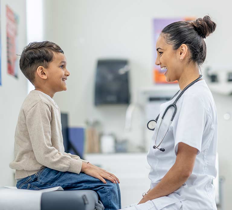 Doctor and child looking at each other