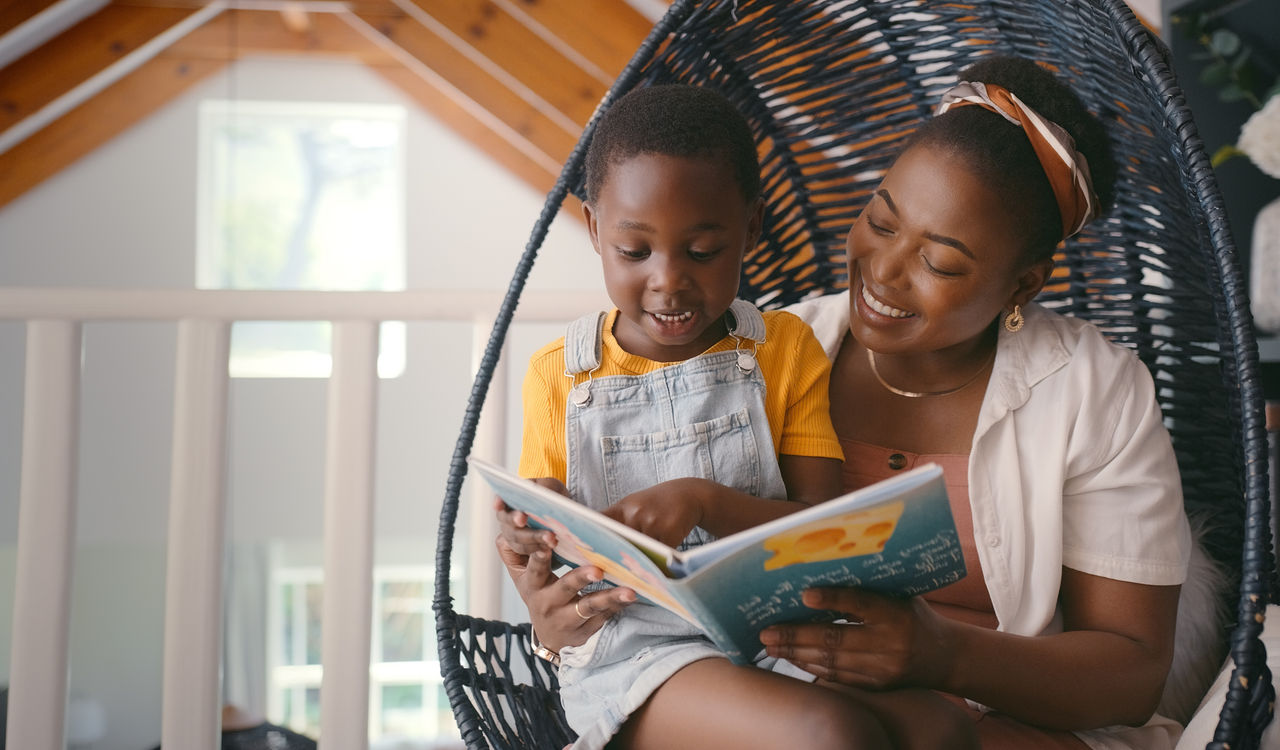 Book, story and mom reading to child for growth, development and learning with knowledge for kid. Apartment, mother and daughter relax in home for literature, fairytale and fantasy for family