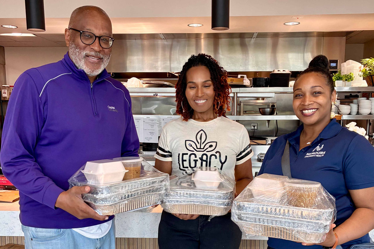 Tim Ayers, Executive Director of West Lakes Partnership, and Brittney Quarterman of Legacy Café are joined by Candiss Ducksworth of the Ginsburg Institute at the heart of West Lakes Wellness Center, supporting food outreach efforts
